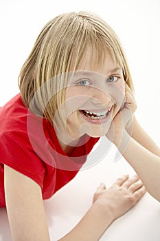 Young Girl Lying On Stomach In Studio