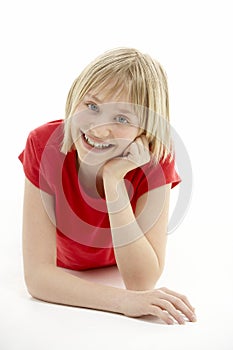 Young Girl Lying On Stomach In Studio