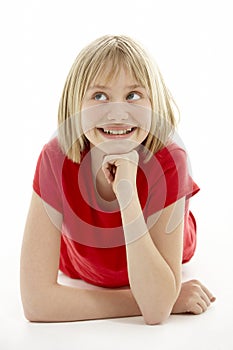 Young Girl Lying On Stomach In Studio