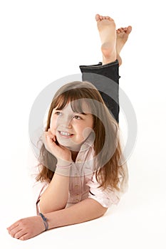 Young Girl Lying On Stomach In Studio