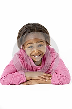 Young Girl Lying On Stomach In Studio