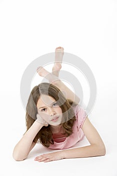 Young Girl Lying On Stomach In Studio