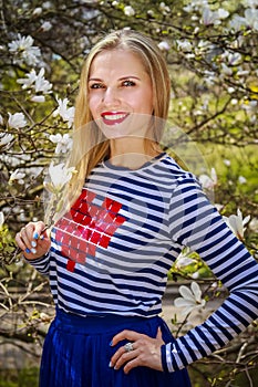 Young Girl with magnolia flower. Women with flowers.