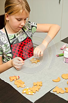 Young girl making gingerbread Christmas cookies