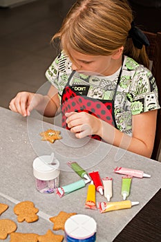 Young girl making gingerbread Christmas cookies