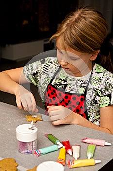 Young girl making gingerbread Christmas cookies