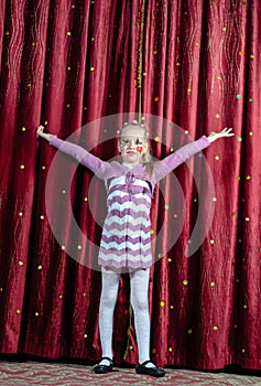 Young girl making her entrance on stage