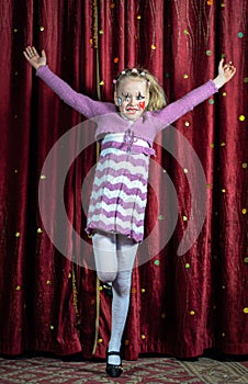 Young girl making her entrance on stage