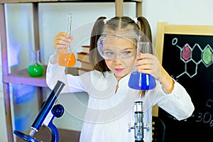 Young girl making science experiments