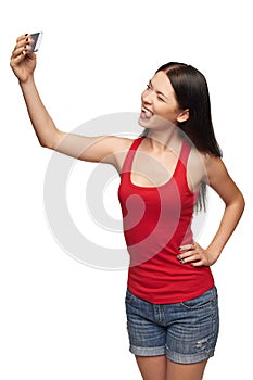 Young girl making selfie through cellphone