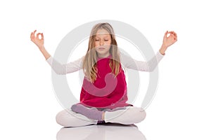 Young girl making yoga