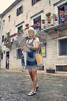 Young girl with map enjoying on journey time