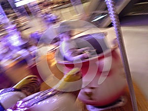 Young girl on a merry go round