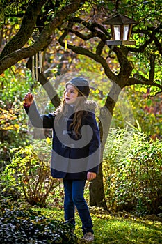 Young girl in mistery garden