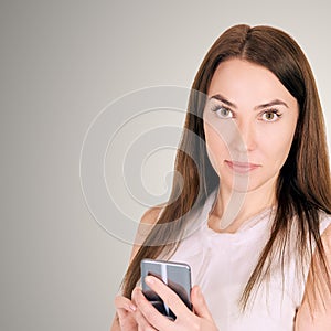 Young girl with mobilephone. Business woman write on screen. Adorable caucasian businesswoman texting to friend