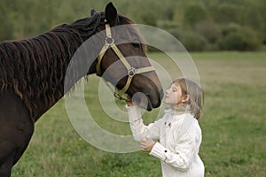 Young girl model wrenched his face to horse. Lifestyle portrait