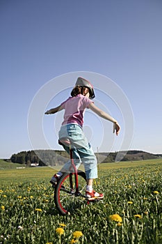 Young girl on monocycle photo
