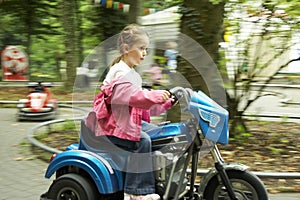 Young girl on motor-bike