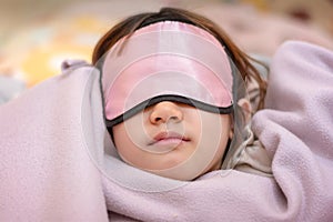 Young Girl Naps with an Eye Patch and a Cozy Blanket