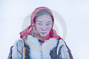 Young girl, in the national winter clothes of the northern inhabitants of the tundra, the Arctic circle