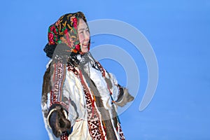 Young girl, in the national winter clothes of the northern inhabitants of the tundra, the Arctic circle