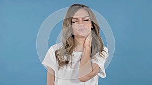 Young Girl with Neck Pain, Blue Background