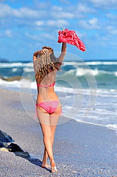 Young girl on the ocean coast