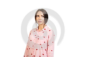 The young girl is offended. Unpleasant, no gift for Valentine`s Day. Isolated on pink background