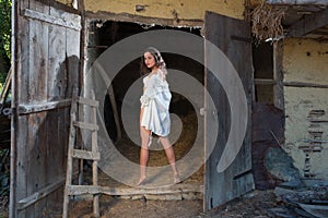 Young girl in old barn