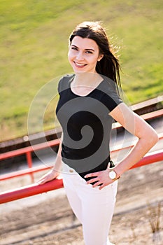 Young girl in old fotball stadium photo
