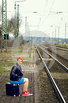 Young girl and a old suitcase