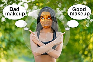 Young girl with orange peel skin, bad skin sign, shows the words