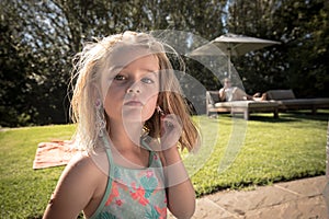 Young girl outdoors with earrings