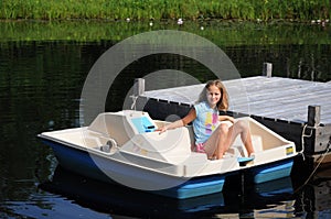 Young girl on a paddleboat