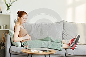 Young Girl in Pain from Period Cramps