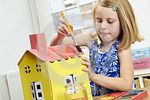 Young Girl Painting House Indoors