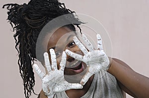 Young girl painting and soiling