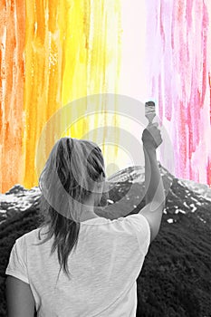 A young girl paints with a brush watercolor sky, concept