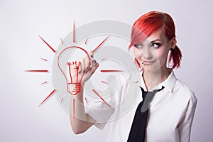 Young girl paints a marker light bulb