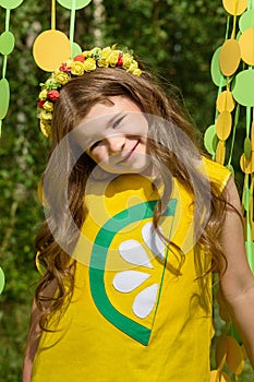Young girl in paper circle colorful curtain garland