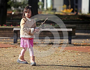 YOUNG GIRL IN PARK