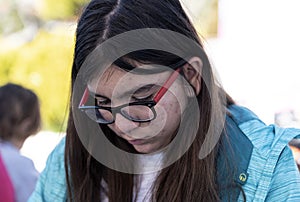 Young girl with pimples and eyewear