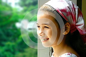 Young girl in pink bandanna photo