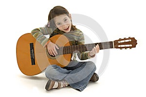 Young girl playing acoustic guitar