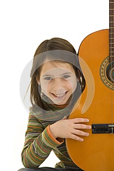 Young girl playing acoustic guitar
