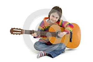 Young girl playing acoustic guitar