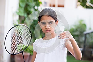 Young girl playing badminton