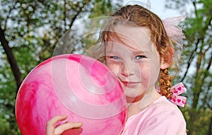 Young girl playing ball