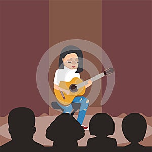 Young girl playing classical guitar at stage