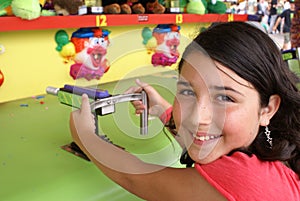 Young Girl Playing a Game at Fair or Carnival